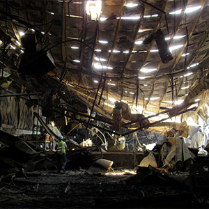 forensic engineer conducting a site inspection at a warehouse fire